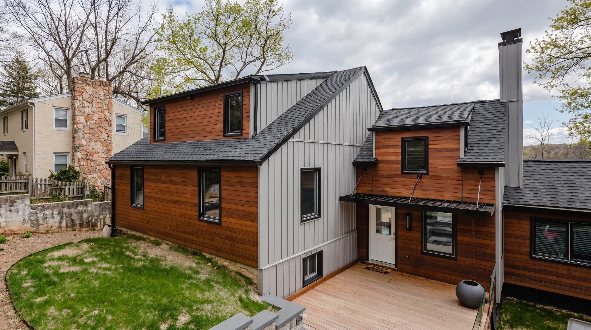 Modern wood and board-and-batten home with black windows